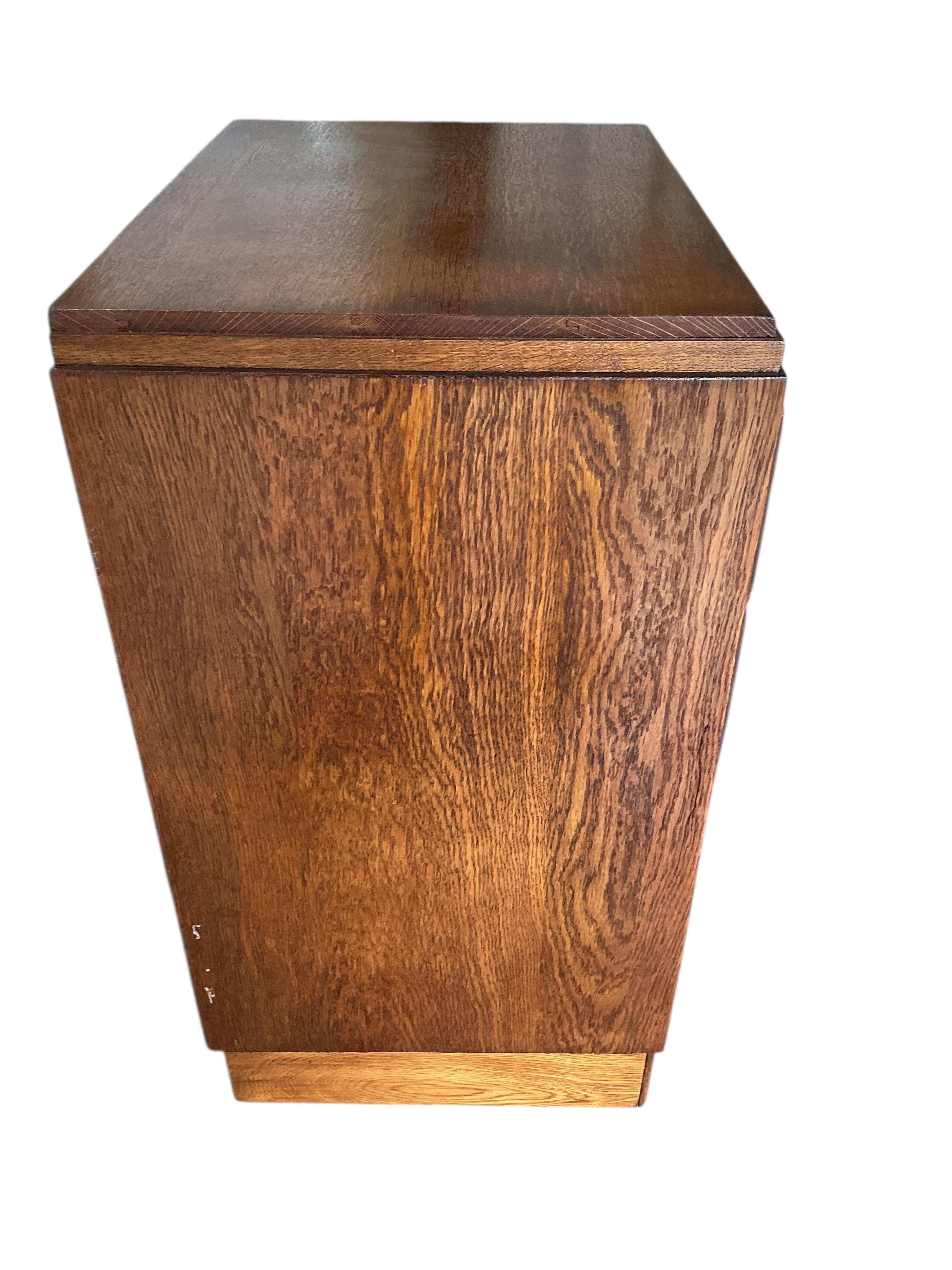 A small early 20th century oak chest of four drawers, width 61cm, depth 44cm, height 83cm